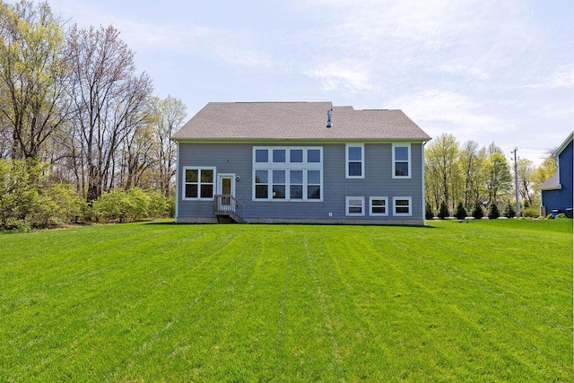2418 Home Rd, Powell, OH 43065 - back of house featuring a lawn