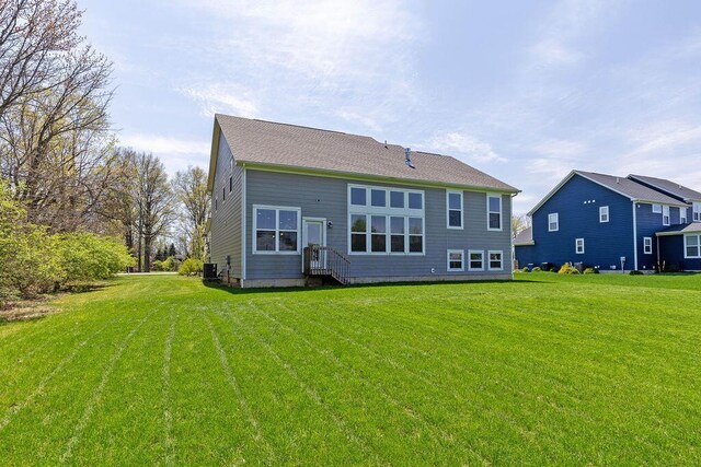 2418 Home Rd, Powell, OH 43065 - back of property with a lawn and entry steps