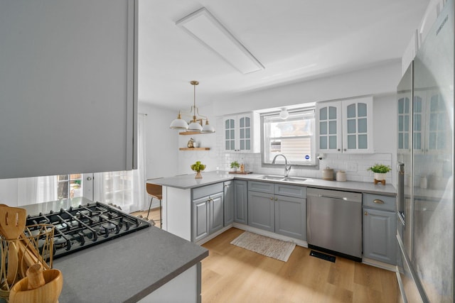 876 Palmer Rd, Columbus, OH 43212 - kitchen with a sink, appliances with stainless steel finishes, gray cabinets, and tasteful backsplash