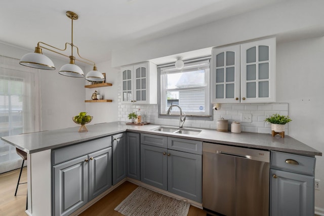 876 Palmer Rd, Columbus, OH 43212 - kitchen with wood finished floors, gray cabinets, a sink, and dishwasher