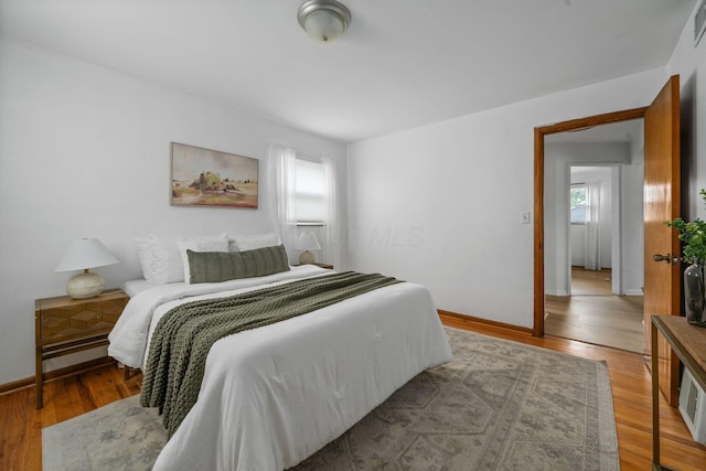 876 Palmer Rd, Columbus, OH 43212 - bedroom with baseboards, visible vents, and light wood-style floors
