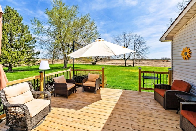wooden terrace with an outdoor hangout area and a yard