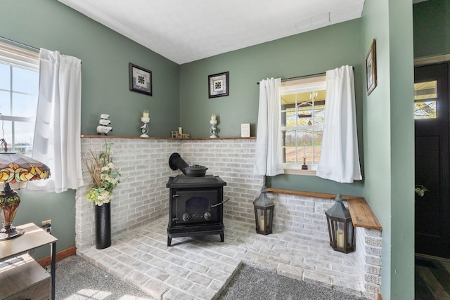 living area with a wood stove and visible vents