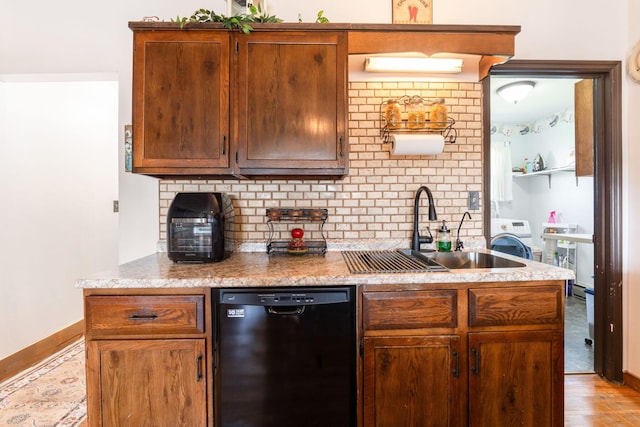 kitchen with a sink, baseboards, backsplash, wood finished floors, and dishwasher