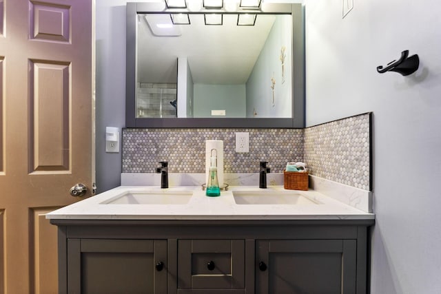 bathroom featuring a sink, backsplash, and double vanity