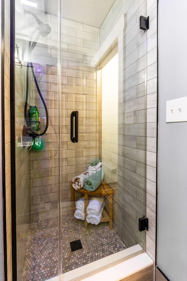 bathroom featuring a sauna and a stall shower