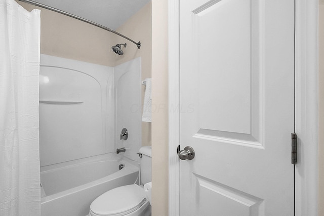 bathroom with shower / bath combination with curtain and toilet