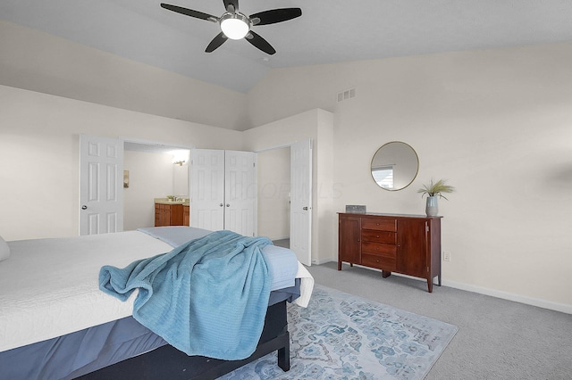 bedroom with carpet flooring, ensuite bathroom, visible vents, baseboards, and high vaulted ceiling