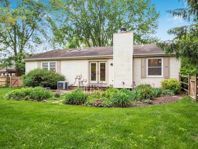3794 Bridle Ct, Columbus, OH 43221 - rear view of house with central air condition unit, a chimney, a patio area, french doors, and a gate