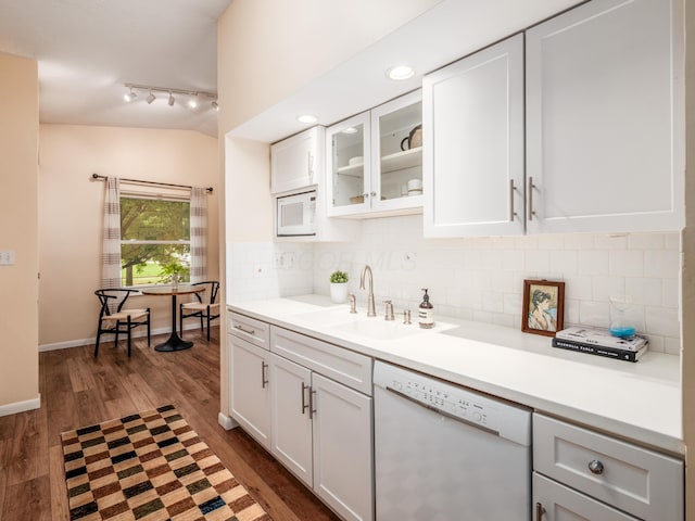 3794 Bridle Ct, Columbus, OH 43221 - kitchen with white appliances, dark wood finished floors, rail lighting, tasteful backsplash, and white cabinets