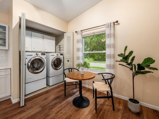 3794 Bridle Ct, Columbus, OH 43221 - laundry area with cabinet space, washing machine and dryer, wood finished floors, and baseboards