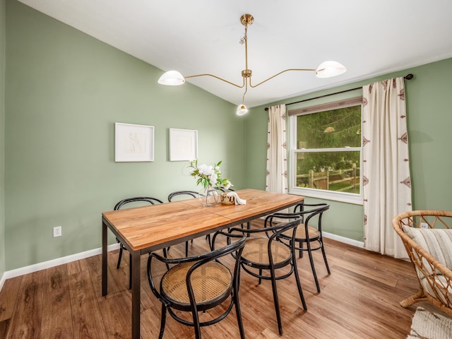 3794 Bridle Ct, Columbus, OH 43221 - dining space featuring light wood-type flooring, baseboards, and lofted ceiling