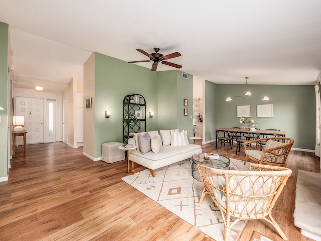 3794 Bridle Ct, Columbus, OH 43221 - living room with wood finished floors, ceiling fan, and baseboards