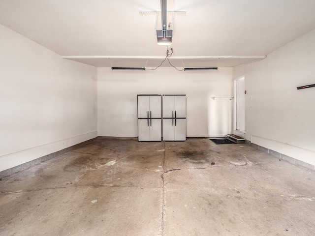 3794 Bridle Ct, Columbus, OH 43221 - garage with a garage door opener and baseboards