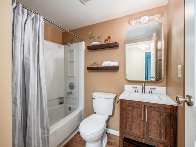 3794 Bridle Ct, Columbus, OH 43221 - bathroom with toilet, shower / tub combo, vanity, wood finished floors, and baseboards