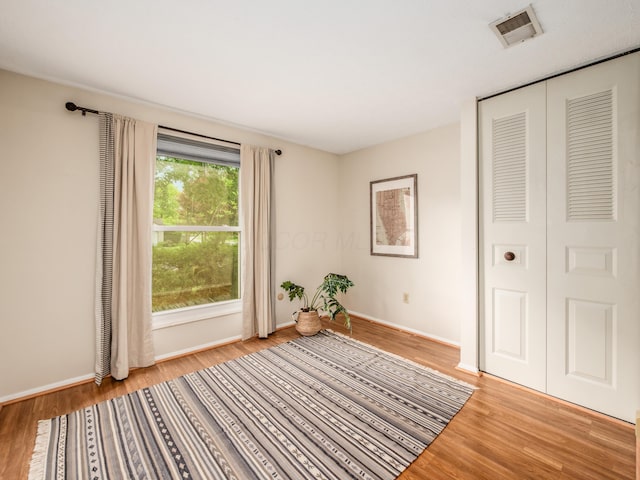 3794 Bridle Ct, Columbus, OH 43221 - unfurnished bedroom with wood finished floors, baseboards, and a closet