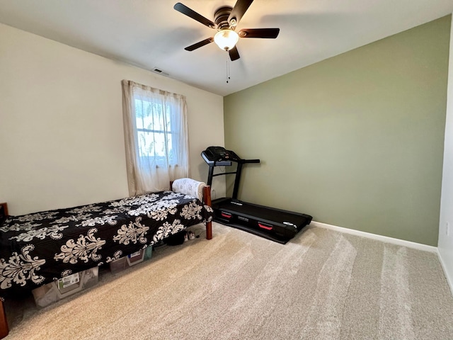 carpeted bedroom featuring visible vents, a ceiling fan, and baseboards