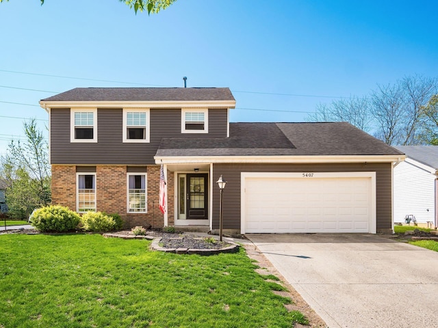 5407 Davidson Rd, Hilliard, OH 43026 - traditional-style house with brick siding, driveway, a front lawn, and a garage