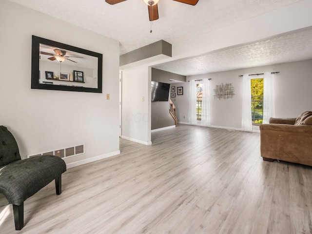 5407 Davidson Rd, Hilliard, OH 43026 - sitting room with a ceiling fan, baseboards, visible vents, and wood finished floors