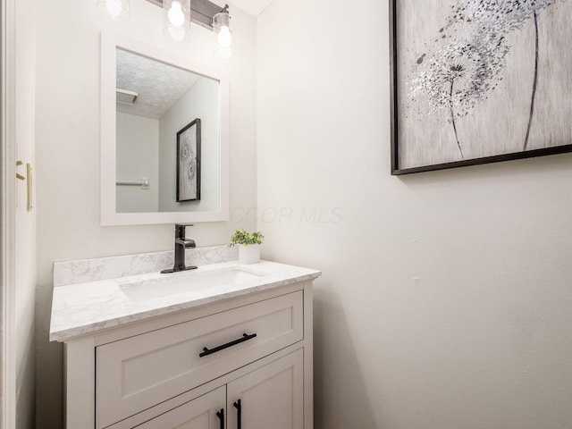 5407 Davidson Rd, Hilliard, OH 43026 - bathroom featuring vanity and a textured ceiling