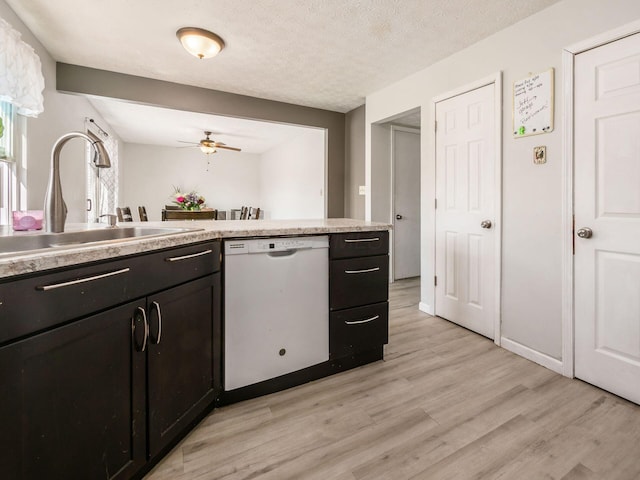 5407 Davidson Rd, Hilliard, OH 43026 - kitchen with white dishwasher, a sink, light countertops, a ceiling fan, and light wood-type flooring