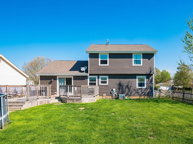 5407 Davidson Rd, Hilliard, OH 43026 - rear view of house featuring fence, a shingled roof, a yard, and a deck