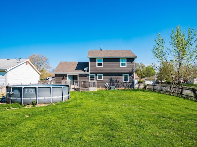 5407 Davidson Rd, Hilliard, OH 43026 - back of house with a yard, a deck, fence, and a fenced in pool