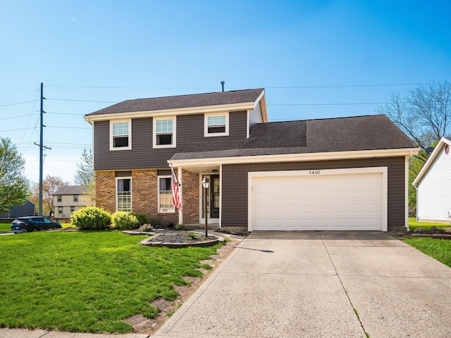 5407 Davidson Rd, Hilliard, OH 43026 - view of front of property with brick siding, an attached garage, driveway, and a front yard