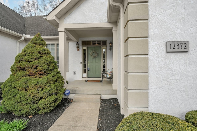 12372 Brook Forest Cir NW, Pickerington, OH 43147 - property entrance with a shingled roof and stucco siding
