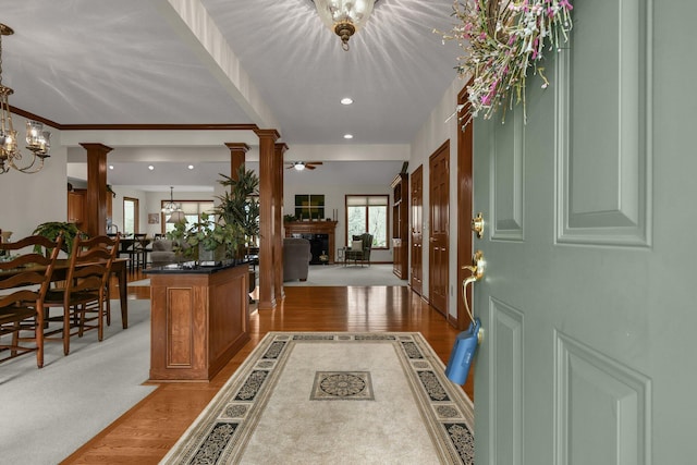12372 Brook Forest Cir NW, Pickerington, OH 43147 - entryway featuring light wood-style floors, ornate columns, a notable chandelier, and recessed lighting