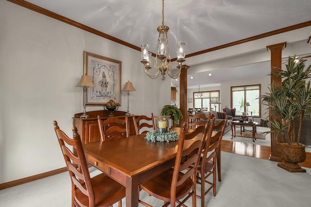 12372 Brook Forest Cir NW, Pickerington, OH 43147 - carpeted dining area with a chandelier, baseboards, and ornamental molding