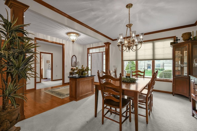 12372 Brook Forest Cir NW, Pickerington, OH 43147 - dining space with ornamental molding, baseboards, a chandelier, and light carpet