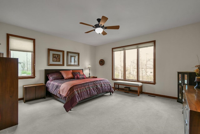 12372 Brook Forest Cir NW, Pickerington, OH 43147 - bedroom with visible vents, light colored carpet, baseboards, and a ceiling fan