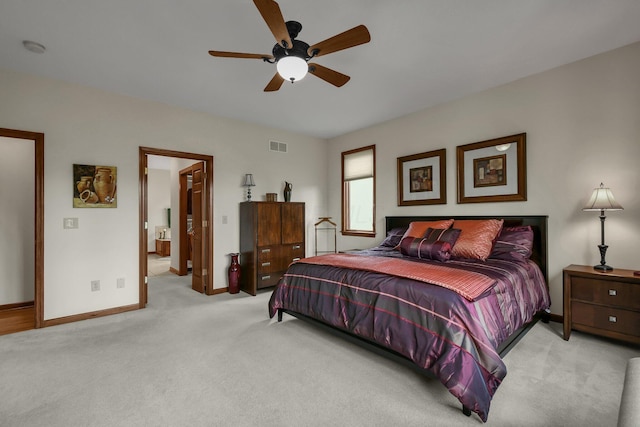 12372 Brook Forest Cir NW, Pickerington, OH 43147 - bedroom with connected bathroom, a ceiling fan, visible vents, light carpet, and baseboards