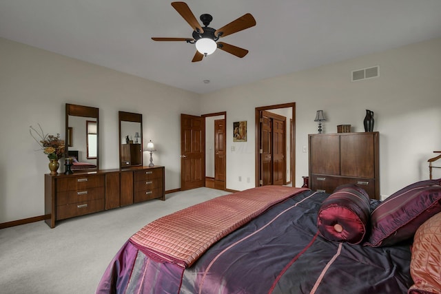 12372 Brook Forest Cir NW, Pickerington, OH 43147 - bedroom with light carpet, visible vents, baseboards, and a ceiling fan