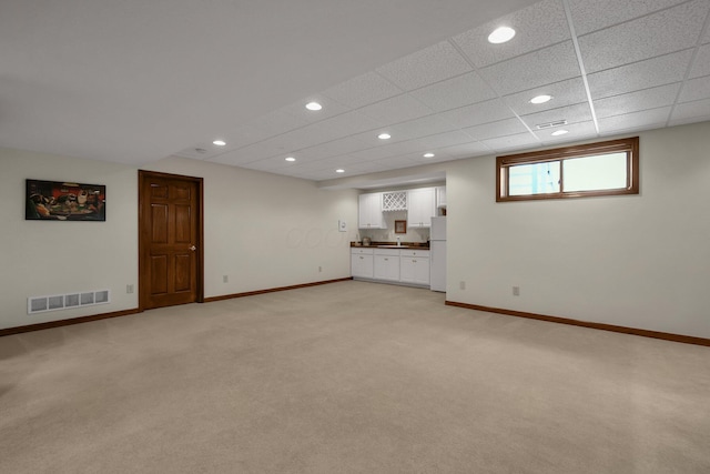 12372 Brook Forest Cir NW, Pickerington, OH 43147 - basement with visible vents, baseboards, freestanding refrigerator, and light colored carpet