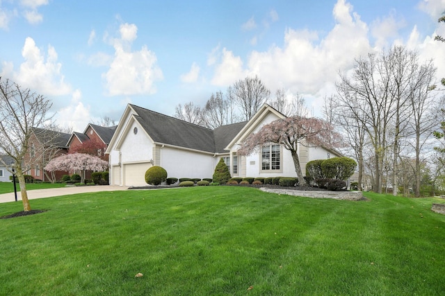 12372 Brook Forest Cir NW, Pickerington, OH 43147 - view of front facade with an attached garage, concrete driveway, a front yard, and stucco siding