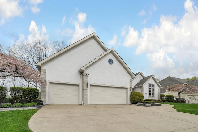 12372 Brook Forest Cir NW, Pickerington, OH 43147 - ranch-style house featuring concrete driveway, a garage, and stucco siding