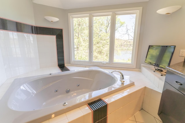 bathroom with a tub with jets