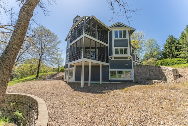 back of house featuring a balcony