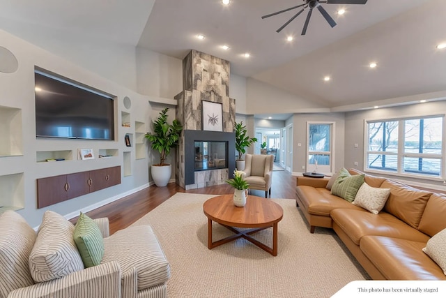 29740 Blosser Rd, Logan, OH 43138 - living room with a ceiling fan, wood finished floors, built in shelves, recessed lighting, and a fireplace