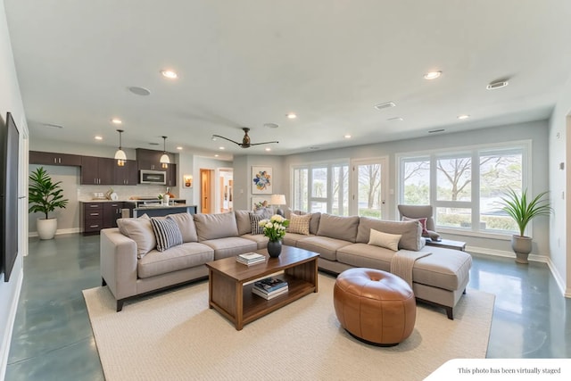 29740 Blosser Rd, Logan, OH 43138 - living area featuring concrete floors, recessed lighting, baseboards, and a ceiling fan