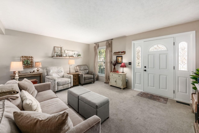 living area featuring light carpet