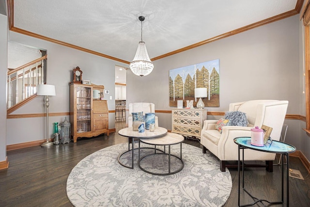 6707 Meadow Glen Dr S, Westerville, OH 43082 - sitting room with baseboards, a chandelier, wood finished floors, stairs, and crown molding