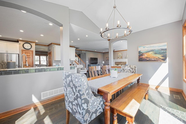 6707 Meadow Glen Dr S, Westerville, OH 43082 - dining room featuring recessed lighting, visible vents, arched walkways, dark wood-type flooring, and baseboards