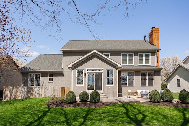 6707 Meadow Glen Dr S, Westerville, OH 43082 - back of house featuring a chimney, fence, stucco siding, an outdoor living space, and a lawn