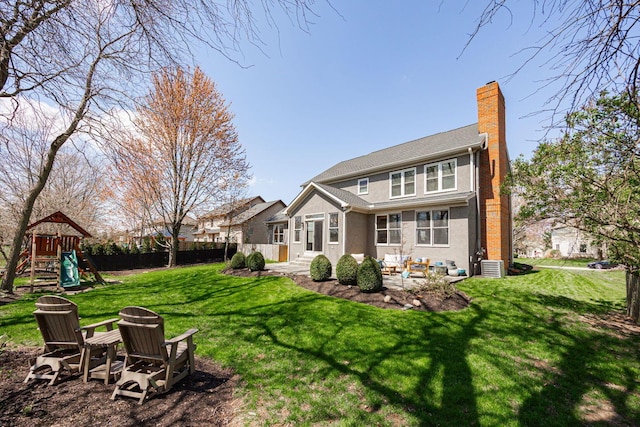 6707 Meadow Glen Dr S, Westerville, OH 43082 - rear view of property with a chimney, fence, a playground, a yard, and stucco siding