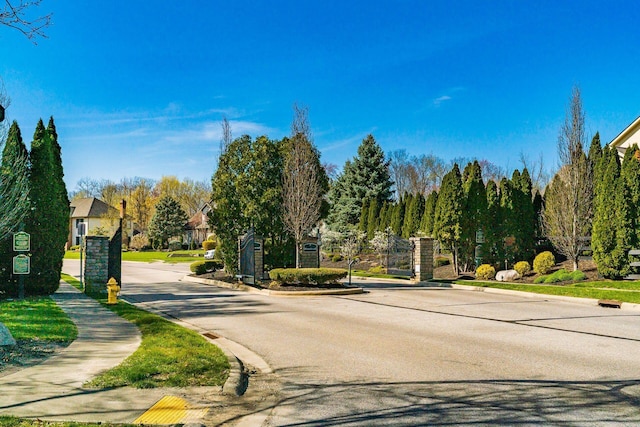 478 Riverbend Ave, Powell, OH 43065 - view of street featuring a gated entry, curbs, and sidewalks