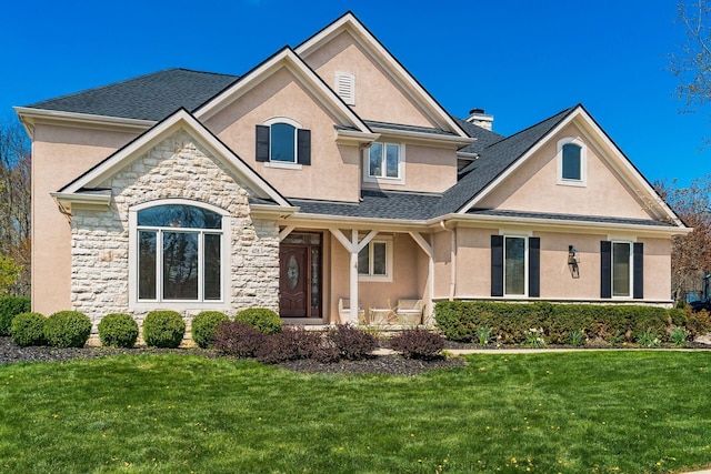 478 Riverbend Ave, Powell, OH 43065 - craftsman inspired home with a chimney, a front lawn, stone siding, covered porch, and stucco siding