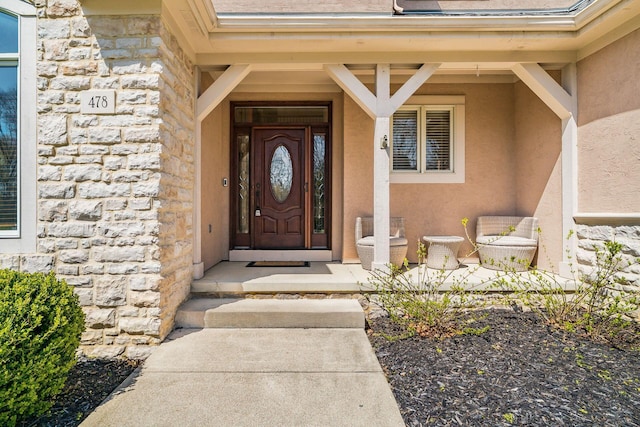 478 Riverbend Ave, Powell, OH 43065 - doorway to property featuring stone siding and stucco siding
